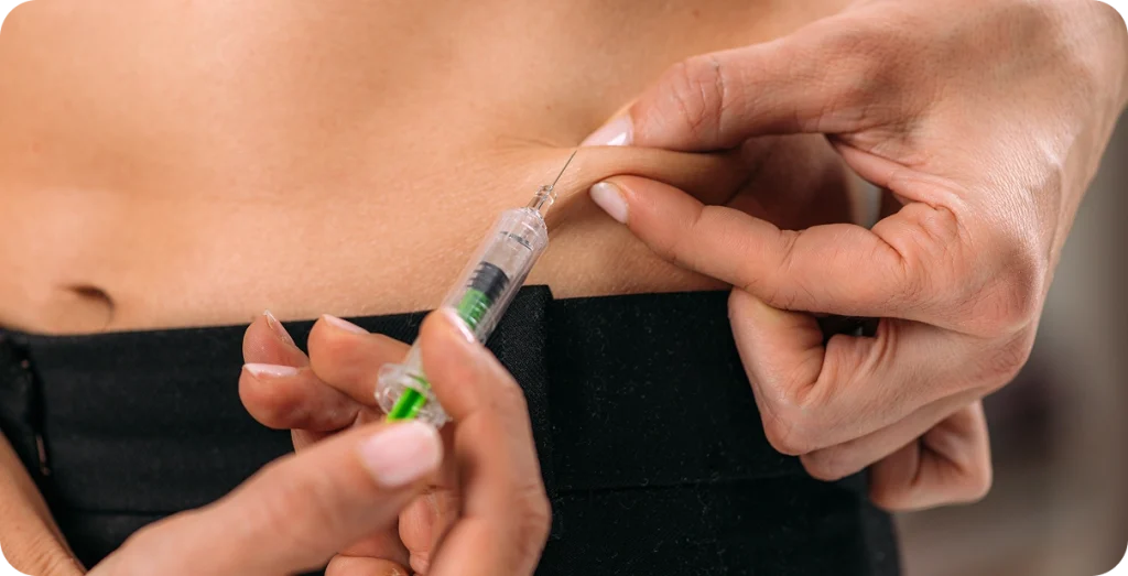 Patient self administering medicine by syringe
